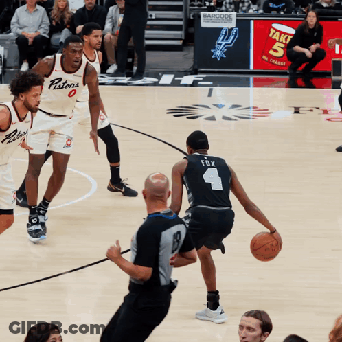 Basketball Player Number 4 Dribbling Ball GIF