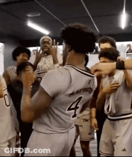 Basketball Player Number 4 Surrounded By Players GIF