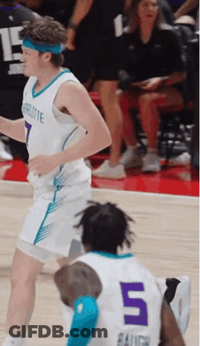 Basketball Player Number 5 Running Towards Another Player GIF
