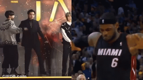 Basketball Player Number 6 Standing Next To Group GIF