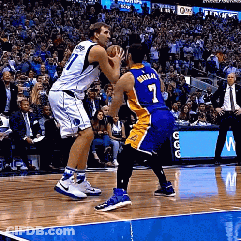 Basketball Player Number 7 Blocking Another Player GIF