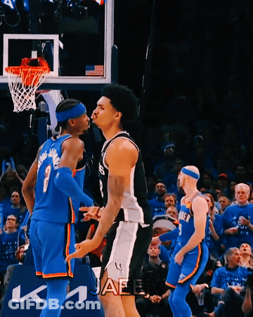 Basketball Player Number 7 Standing Next To Another Player GIF