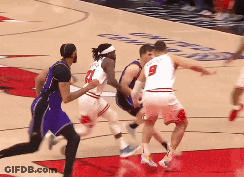 Basketball Player Number 9 Blocking Player Number 21 GIF
