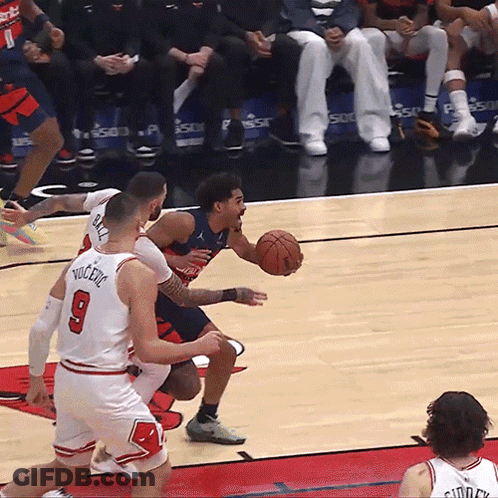 Basketball Player Number 9 Dribbling GIF