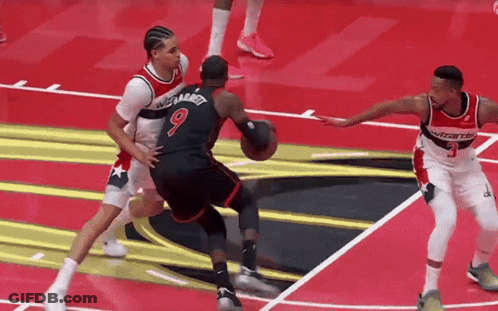 Basketball Player Number 9 Dribbling GIF