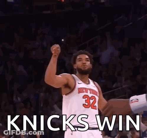 Basketball Player Raising Fist In White Jersey Number 32 GIF