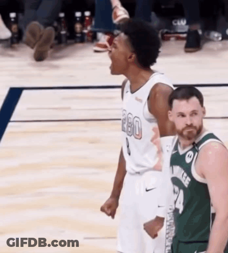 Basketball Player Screaming In The Air With Opponent GIF