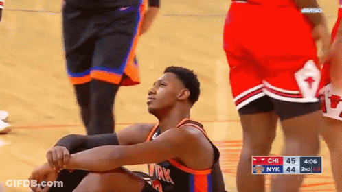 Basketball Player Sitting During Game GIF