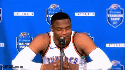 Basketball Player Sitting In Front Of Microphone Eyes Closed GIF