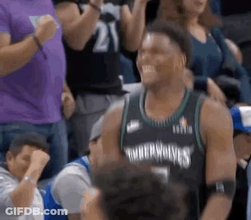 Basketball Player Sitting In Stands Smiling GIF