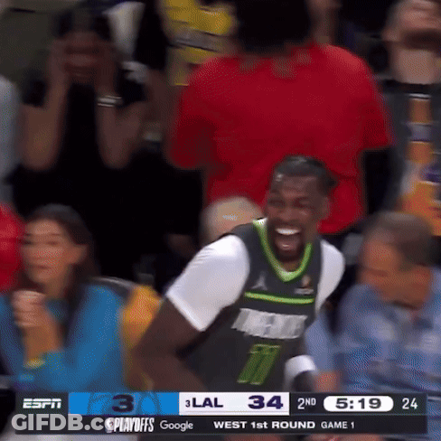 Basketball Player Smiling In Stands GIF