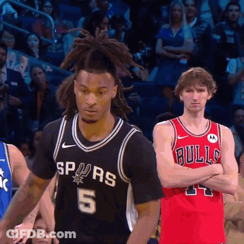 Basketball Player Spurs Jersey Next To Bulls Player GIF