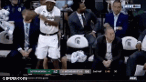 Basketball Player Standing In Stands During Game GIF
