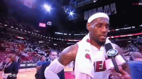 Basketball Player Talking Into Microphone In Heat Jersey GIF
