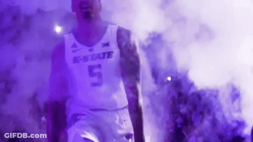 Basketball Player Walking Through Smoke Tunnel GIF