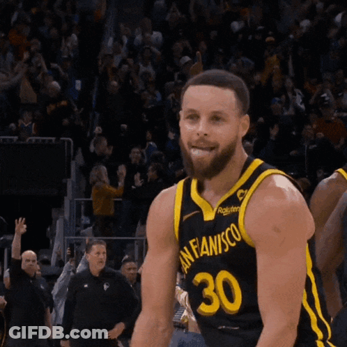 Basketball Player Wearing A Black And Yellow Jersey With The Number 30 On It GIF