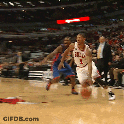 Basketball Player Wearing A Bulls Jersey Dribbles The Ball GIF