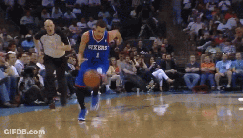 Basketball Player Wearing A Sixers Jersey Dribbles The Ball GIF