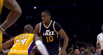 Basketball Player Wearing A Yellow Jersey With The Number 4 GIF