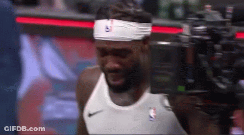 Basketball Player Wearing Headband And White Shirt GIF