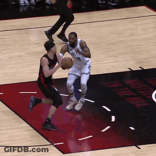 Basketball Player Wearing Number 10 Dribbling GIF
