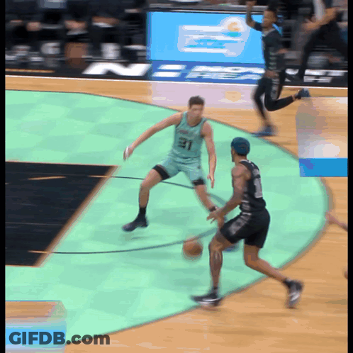 Basketball Player Wearing Number 31 Dribbling GIF