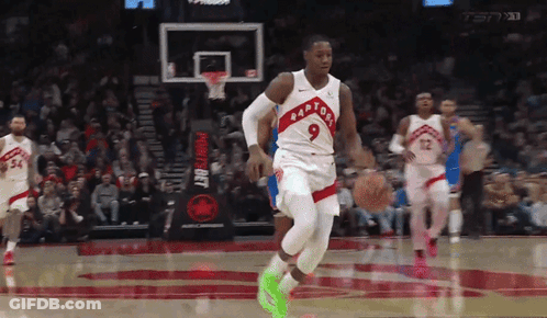 Basketball Player Wearing Number 9 Dribbling GIF