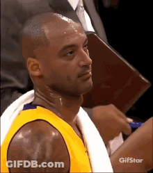 Basketball Player With Towel Around Neck And Gifstar Logo GIF