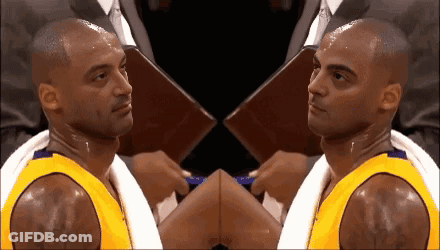 Basketball Player With Towel Around Neck Looking At Camera GIF