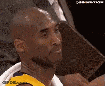 Basketball Player With Towel Around Neck Sitting In Chair GIF