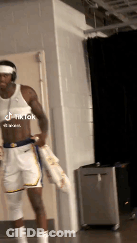 Basketball Player Without Shirt Holding Towel GIF