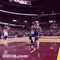 Basketball Players Are Playing A Game Of Basketball In A Stadium With A Crowd Watching . GIF