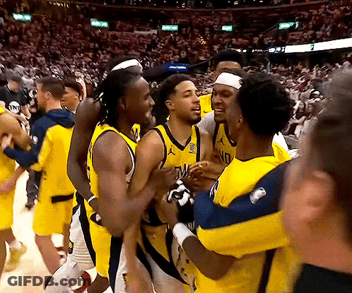 Basketball Players Hugging, One With NC Jersey GIF