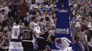 Basketball Players In Front Of Stadium Crowd GIF