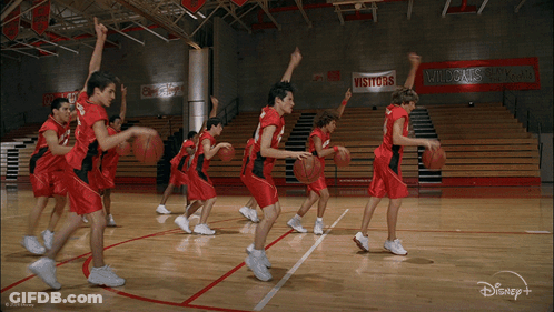 Basketball Players In Red Uniforms With Number 14 GIF