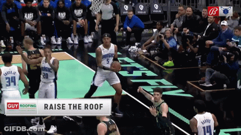 Basketball Players On A Court With A Banner That Says Raise The Roof At The Bottom GIF