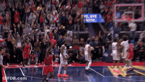Basketball Players On A Court With A Sign That Says Bye Plastic In The Background GIF
