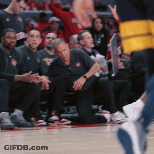 Basketball Players On Bench With UCLA Shirt GIF
