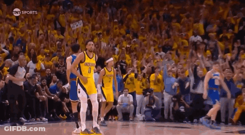 Basketball Players On Court In Front Of Fans GIF