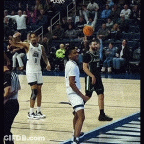 Basketball Players On Court With Number 9 GIF