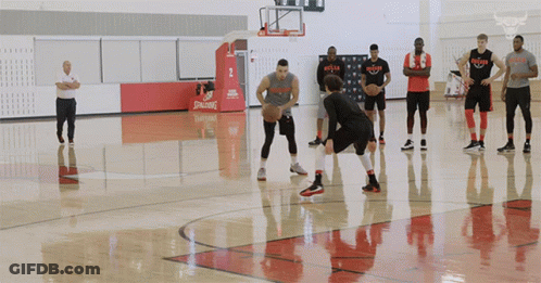 Basketball Players On Court With Spalding Logo GIF