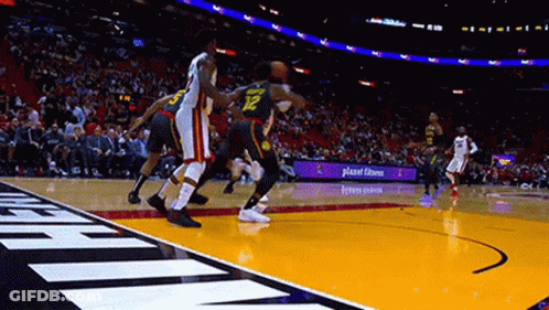 Basketball Players Playing Before Crowd GIF