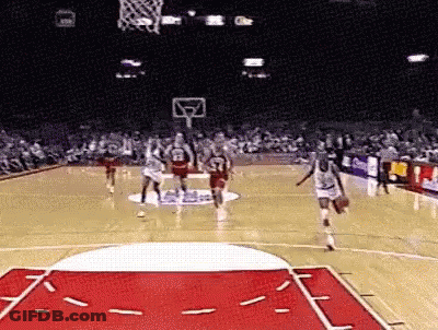 Basketball Players Playing Game With Crowd Watching GIF