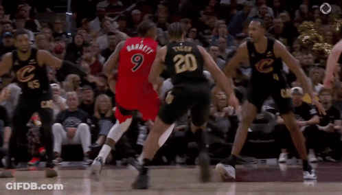 Basketball Players Playing In Front Of Crowd GIF