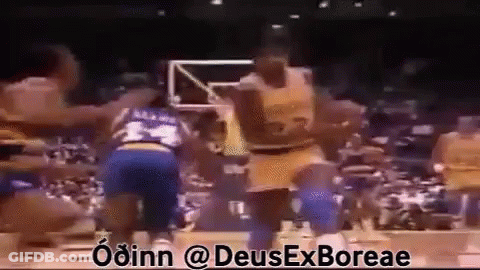 Basketball Players Playing In Front Of Crowd GIF