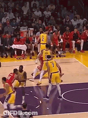 Basketball Players Playing With Referee Number 18 GIF