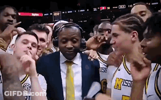 Basketball Players Posing With Man In Headphones GIF