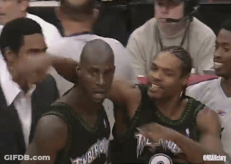 Basketball Players Sitting In Stadium With Timberwolves Jersey GIF
