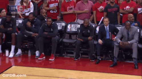 Basketball Players Sitting In Stands GIF