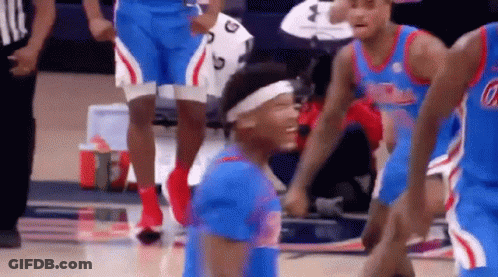 Basketball Players Standing On Court Laughing GIF